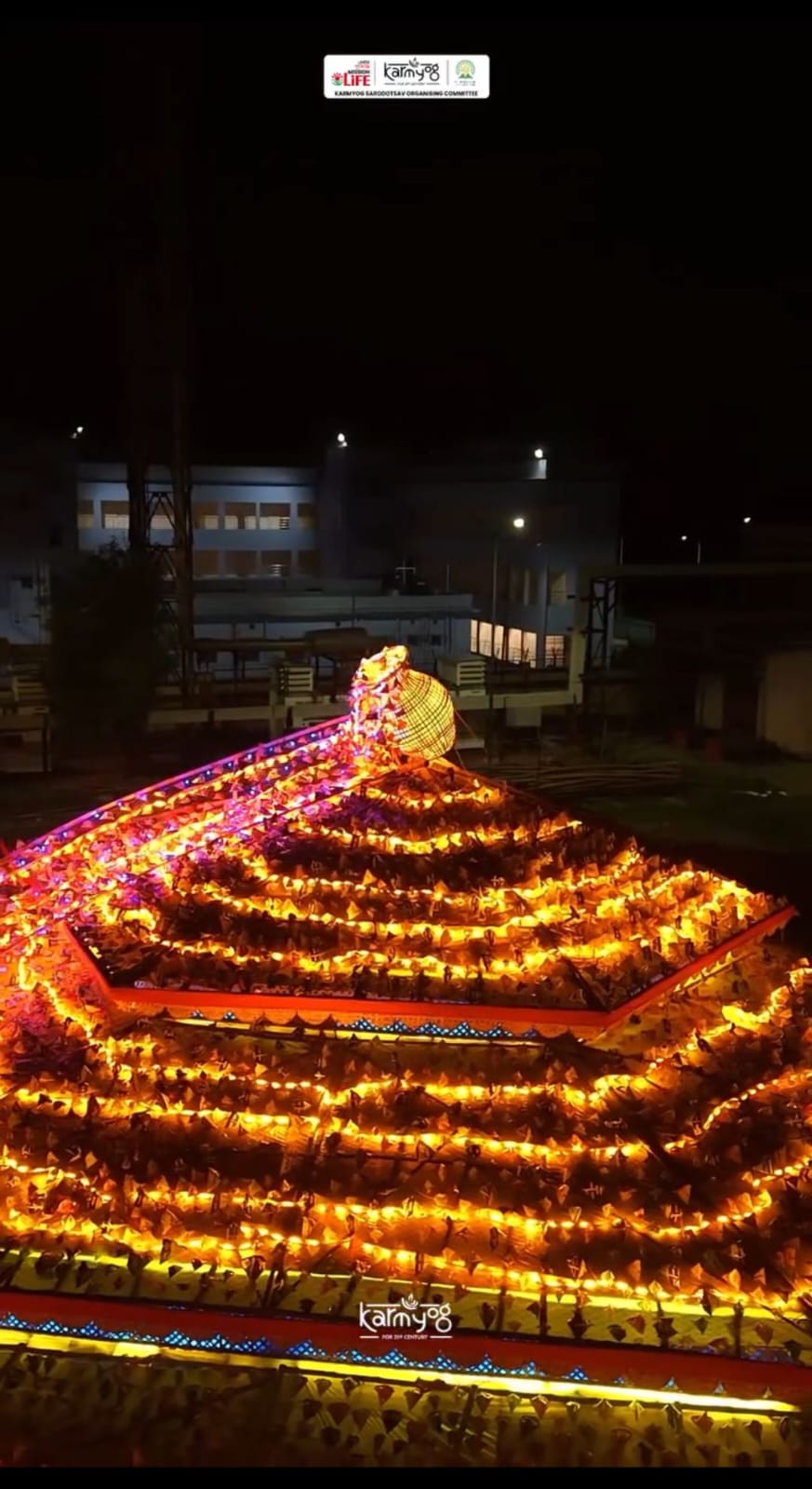 Aerial view of the completed pyramid at night, straight down, illuminated with fairy lights