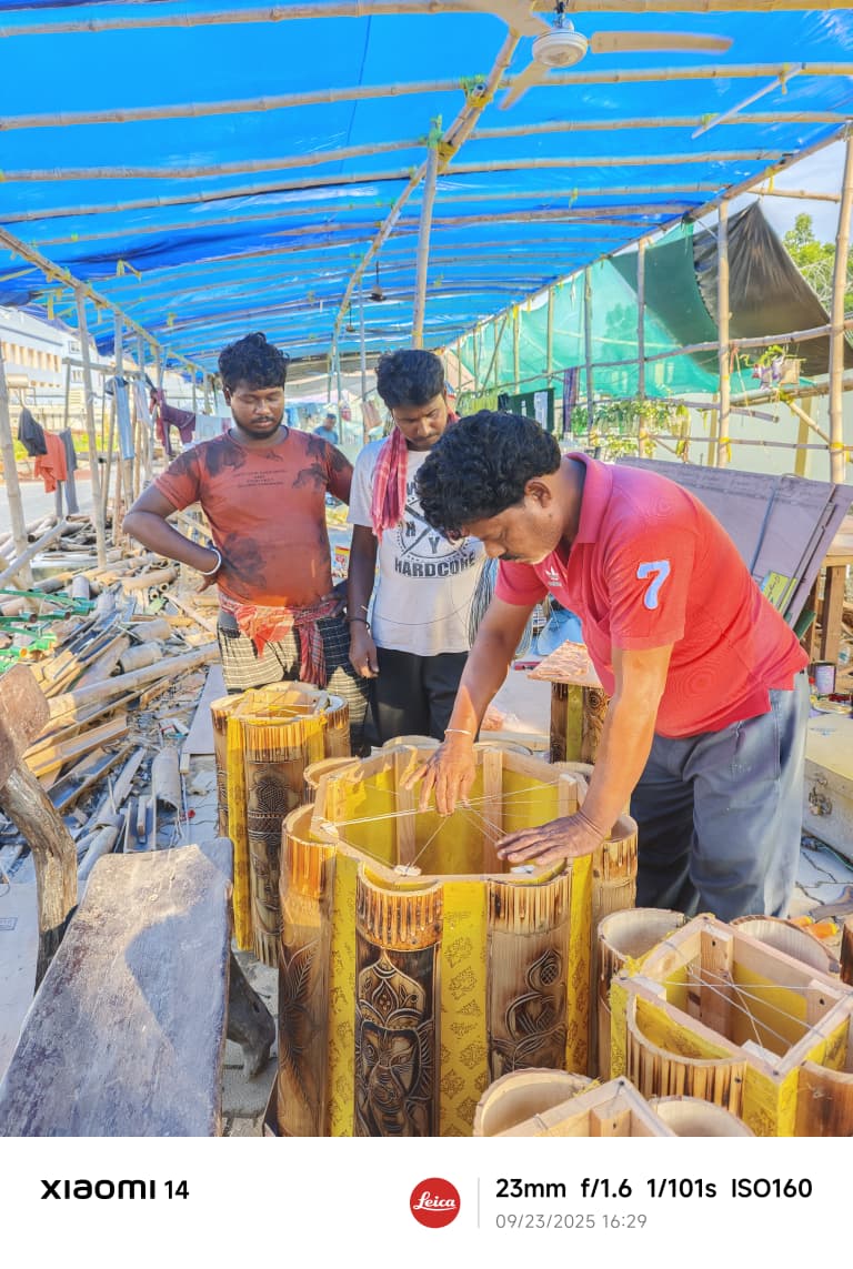 Karigars assembling carved bamboo lantern cylinders